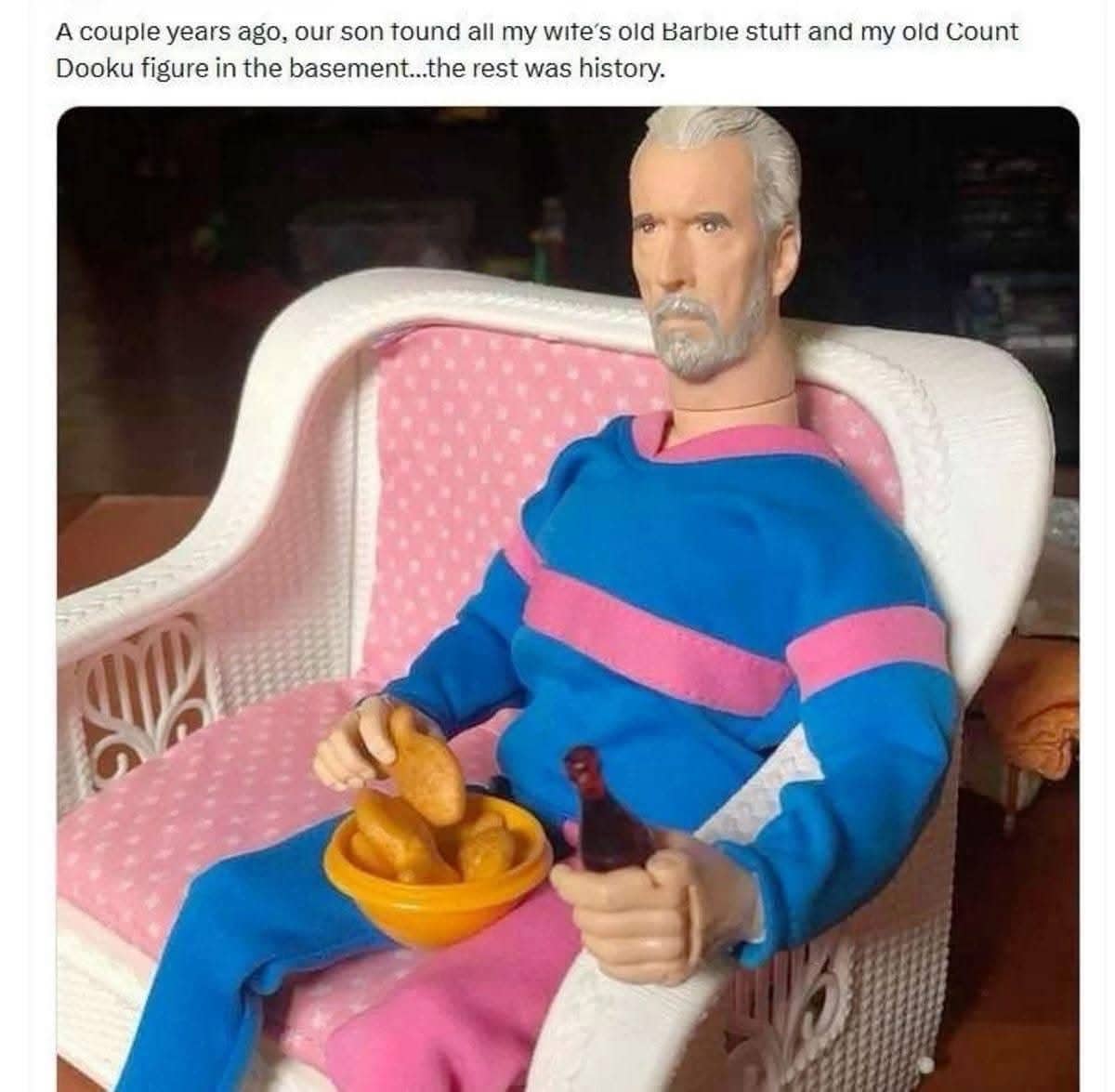 Count Dooku action figure wearing bright doll clothes sitting on pink chair holding tiny soda.