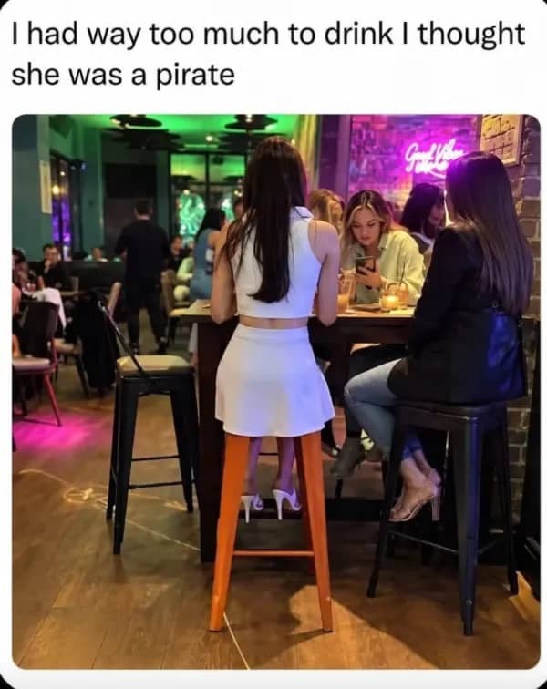 Optical illusion photo of a girl sitting on a bar stool looking like a pirate.