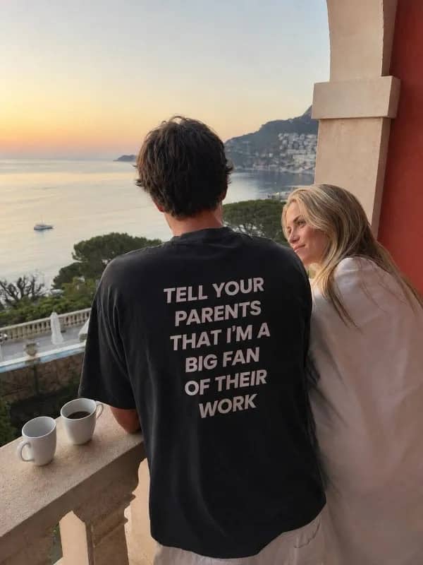 Man wearing t-shirt reading tell your parents im a big fan funny relationship meme.