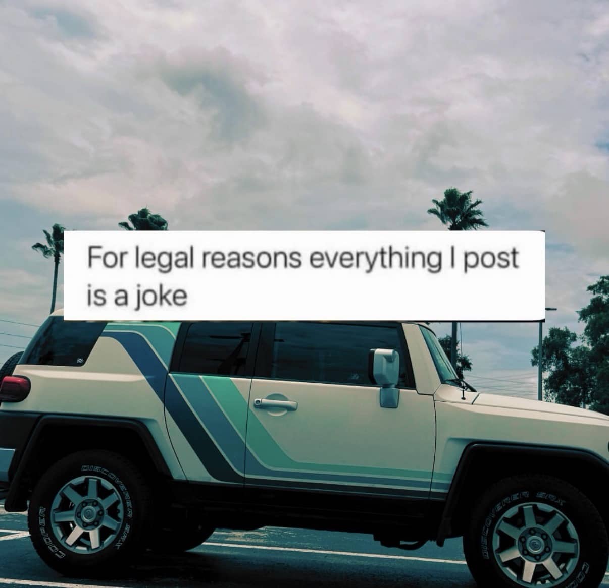 Custom white and teal off-road vehicle with text saying everything posted is a joke.