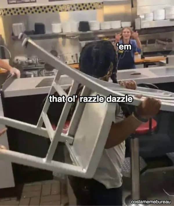 Server carrying a chair overhead with text that ol razzle dazzle funny meme.