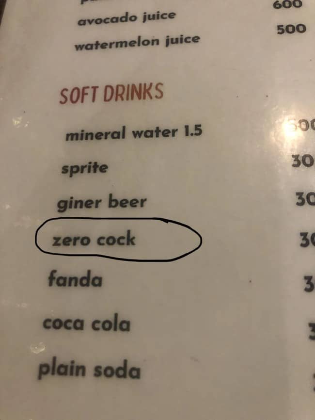 Soft drink menu typos listing zero cock option circled on laminated beverage price list.