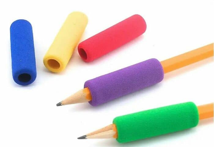 Colorful squishy foam pencil grips slid onto standard yellow number two pencils featured in 90s pics.