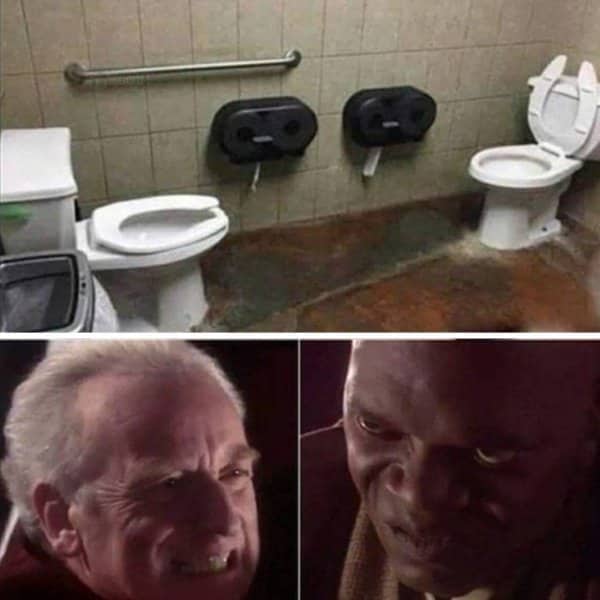 Two toilets facing each other in a bathroom above Star Wars characters glaring