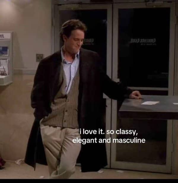 Friends scene of Chandler in a long coat with subtitle about being classy and elegant