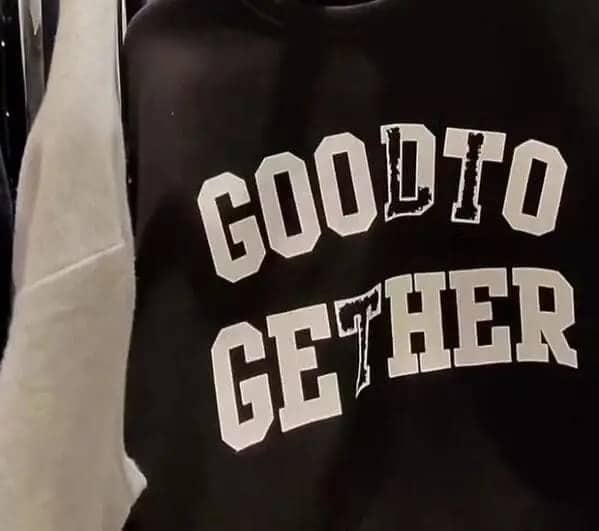 Black varsity sweatshirt with misspelled white lettering reading good to gether across front panel.