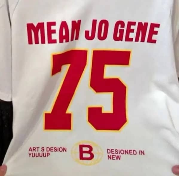 White sports jersey shirt featuring funny gibberish sports text like art s desion yuuuup.