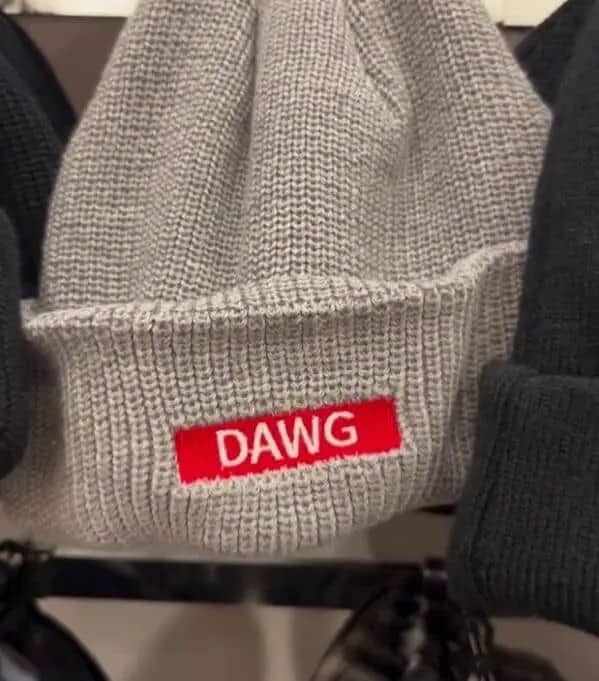 Grey ribbed beanie hat featuring a red box logo with white text reading dawg.