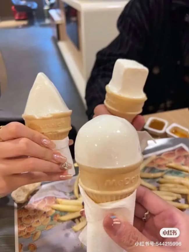 Three McDonald's soft serve cones in odd shapes: a cone, a cube, and a dome.