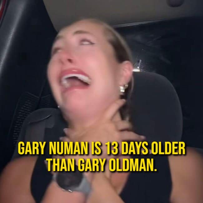 Woman clutching her neck in hysterical disbelief over a mind-bending random fact stating Gary Numan is older than Gary Oldman.
