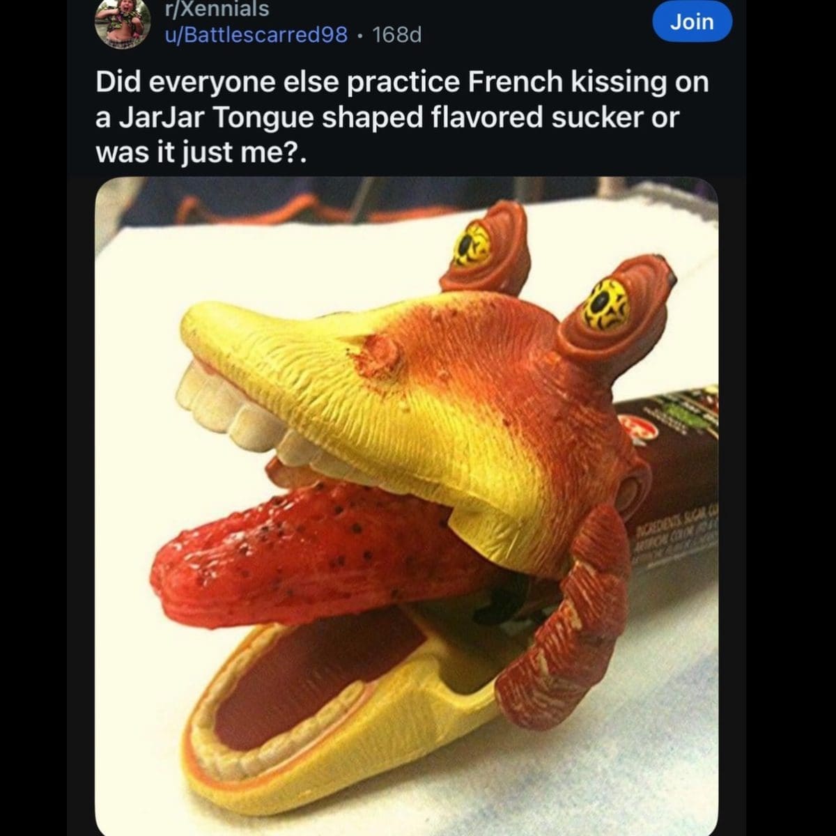 Jar Jar Binks candy dispenser with a long red tongue shaped lollipop sticking out of its mouth