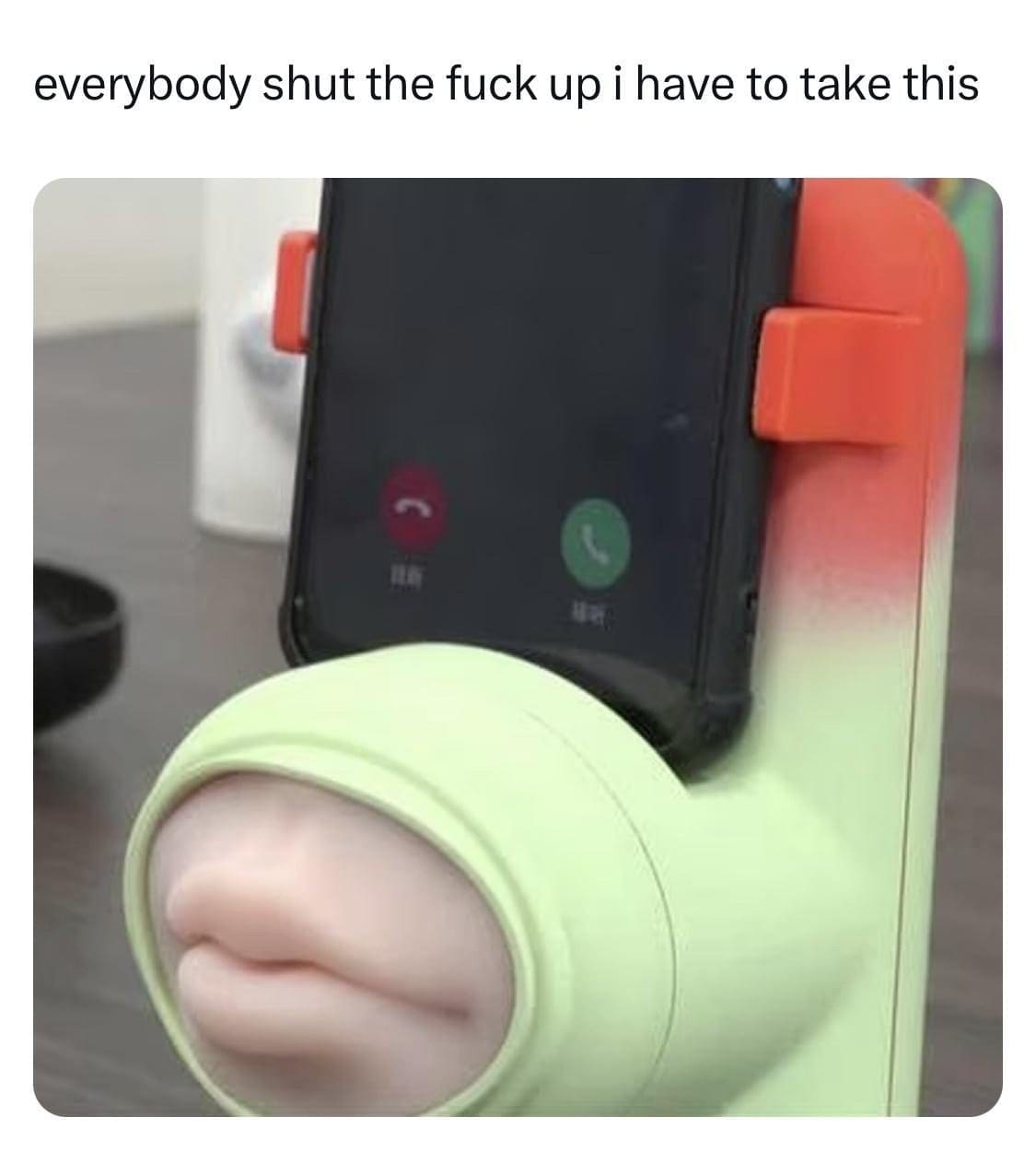 Novelty phone stand with a silicone mouth, captioned as having to take an important call.
