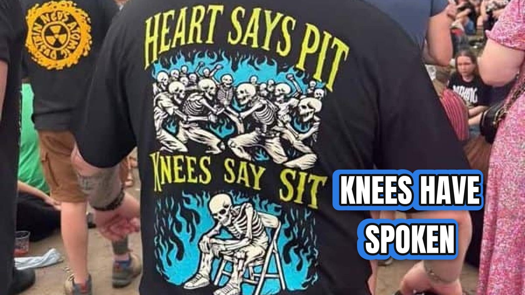 Concert crowd with a man's shirt reading heart says pit, knees say sit, one of the relatable memes for overthinkers.