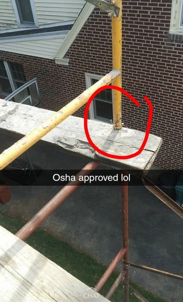 Scaffolding pole resting on a cracked concrete plank circled in red with a joking caption