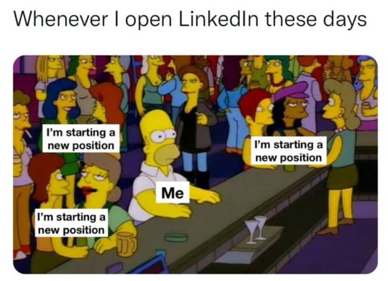 Homer Simpson sitting alone in a crowded bar surrounded by LinkedIn job updates in a self employed meme.