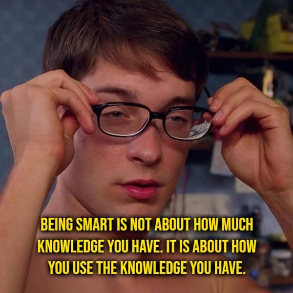 Young man lifting his glasses beside a shower thought about what being smart actually means