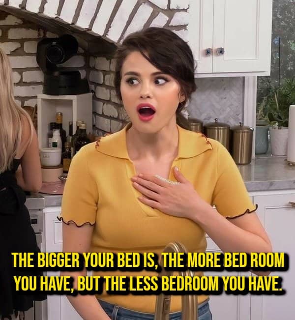 Woman reacting in surprise beside a shower thought about bed room versus bedroom space