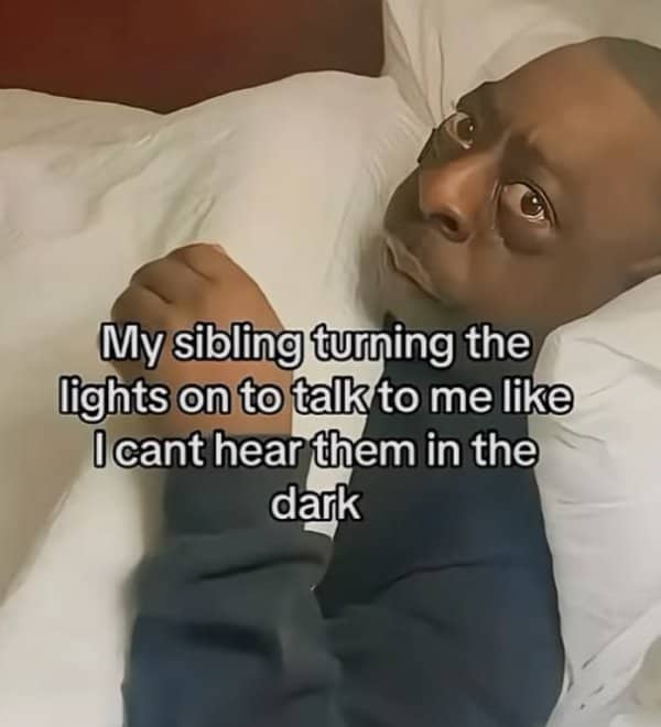 Beetlejuice actor looking shell-shocked in bed with text about turning lights on at night.