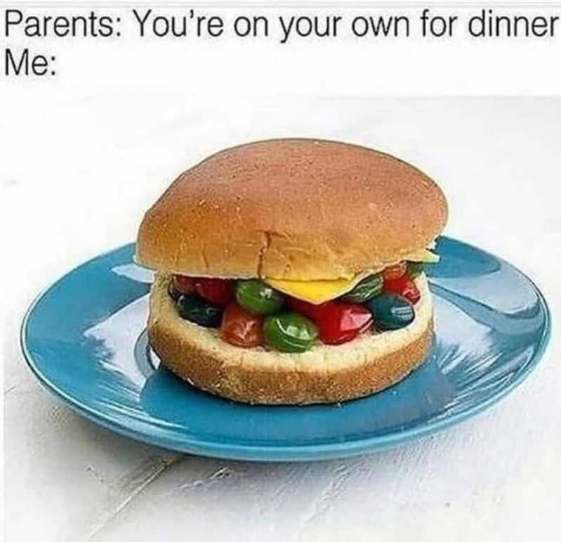 Jelly beans placed inside a hamburger bun illustrating a terrible childhood cooking dinner meme.