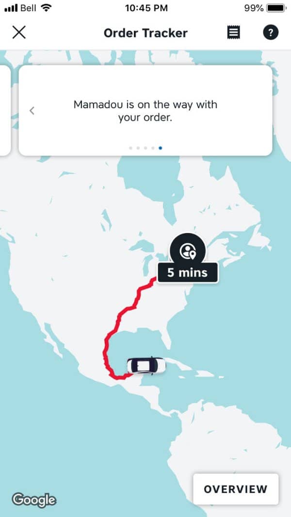 Food delivery tracker showing a driver route from Mexico to Canada, five minutes away.