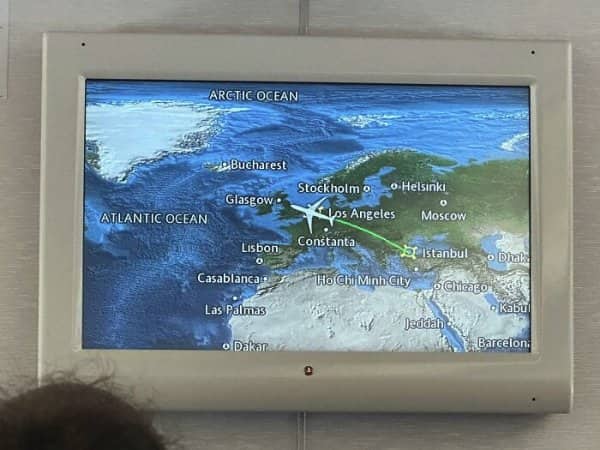 In-flight map placing Los Angeles, Chicago, and Ho Chi Minh City across Europe.