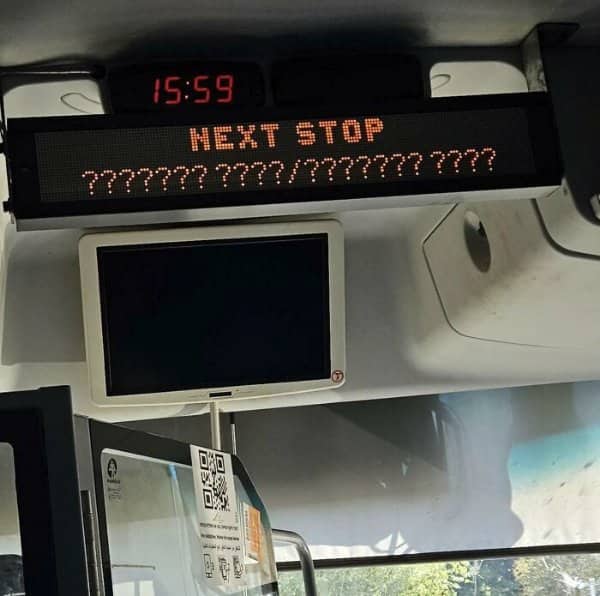 Bus display reading next stop followed by a long line of question marks.