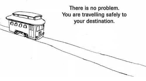 Trolley rolling on a single track with text saying there is no problem at all