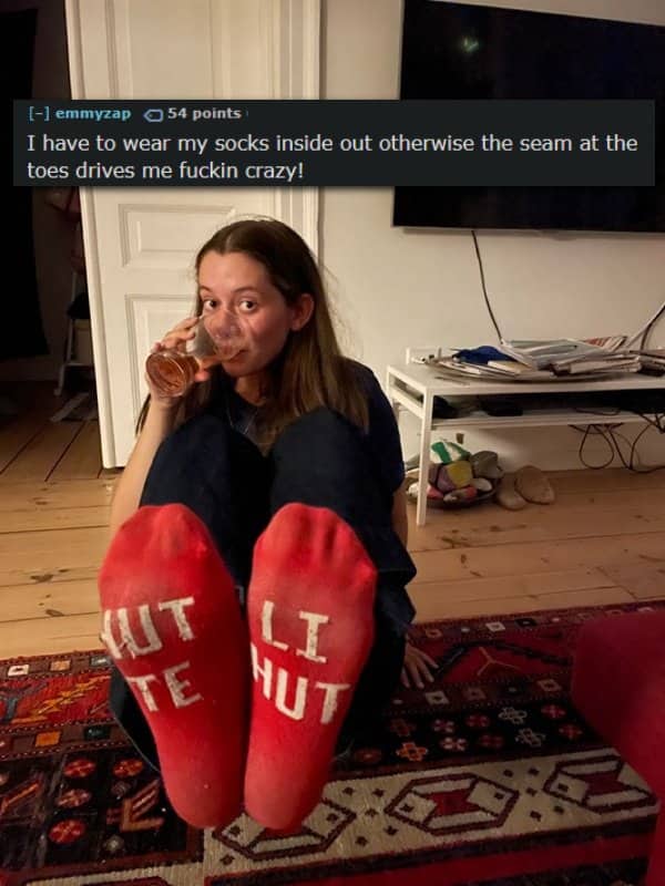 Woman holding glass sitting with inside-out red socks and sock seam confession text.
